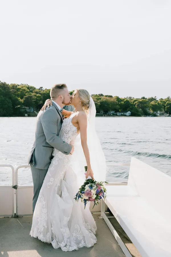Couple kissing on the pontoon boat